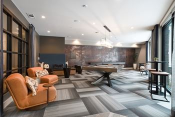 Game room featuring billiards, shuffleboard & wall scrabble